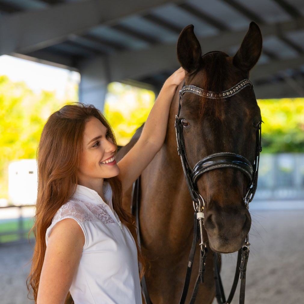Katie Rodriguez with her horse in the arena